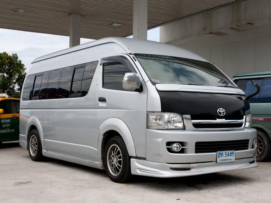 A white minibus used for group transport